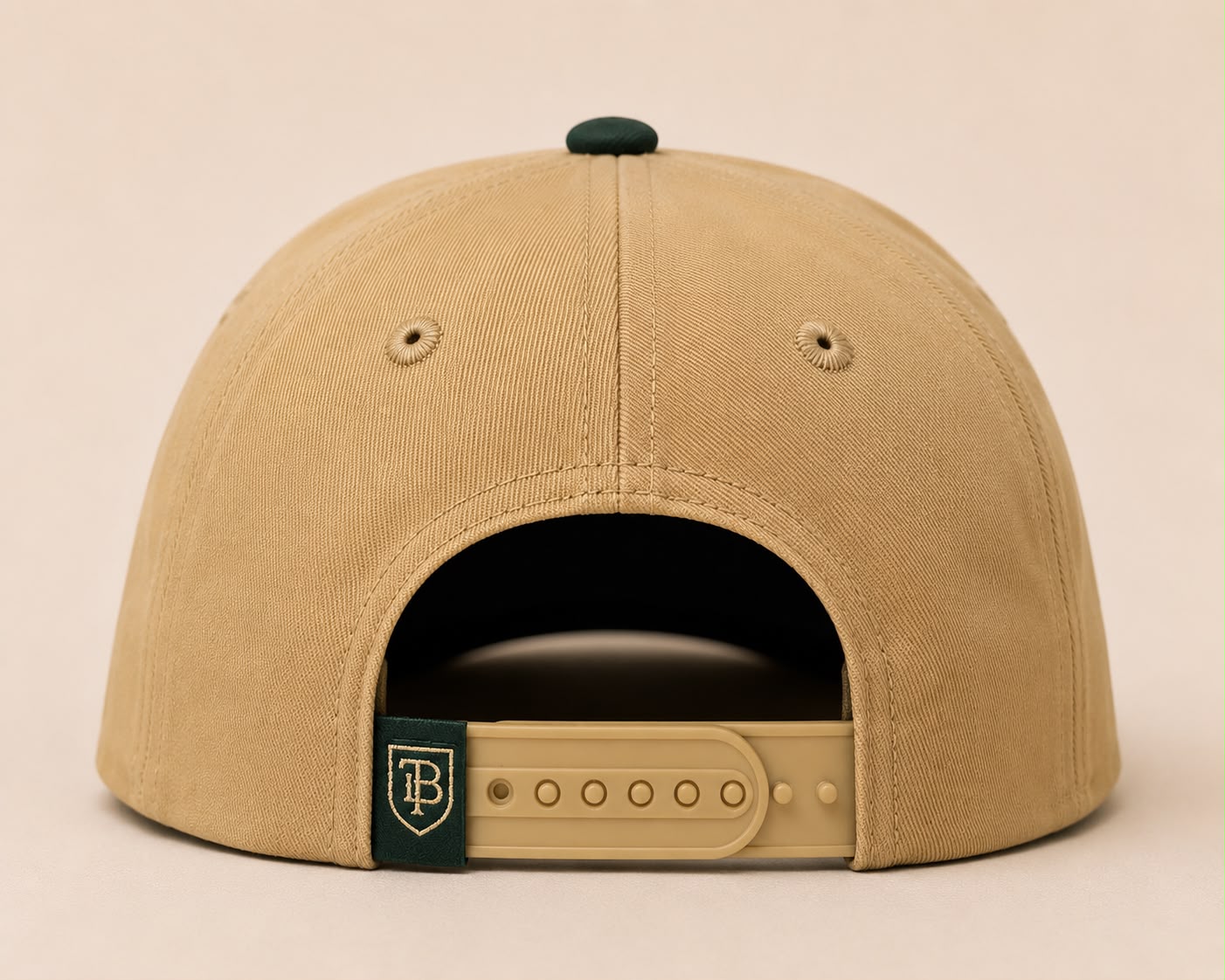 Beige cap with a brand logo on a beige background